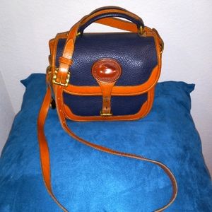 Dooney and Bourke vintage purse with strap.
